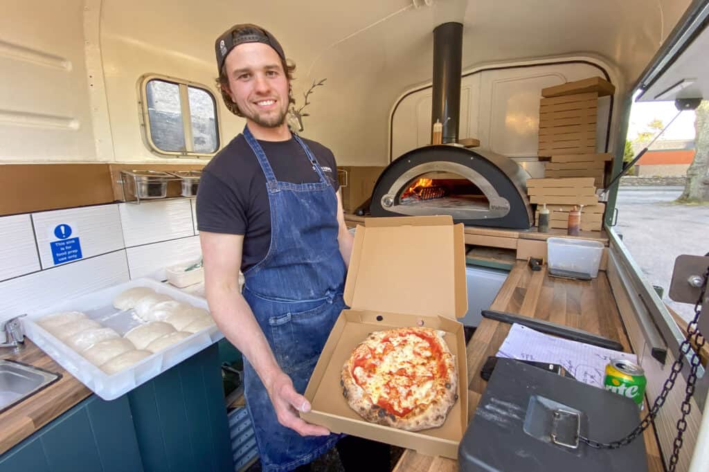 Alan and cooked pizza